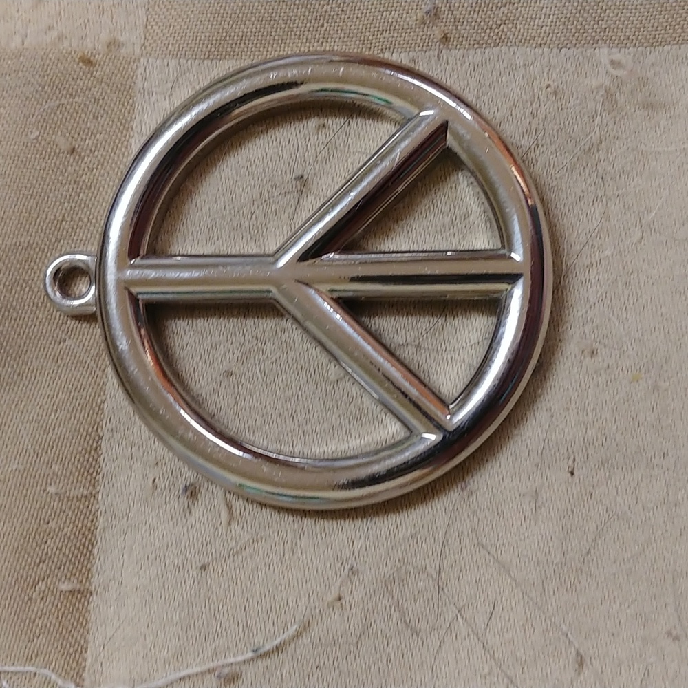 Silver metal peace sign pendant